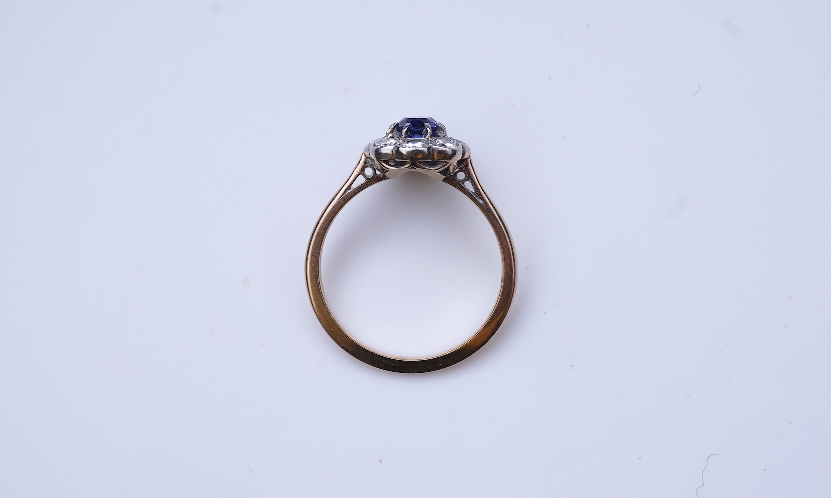 A synthetic sapphire and diamond ring